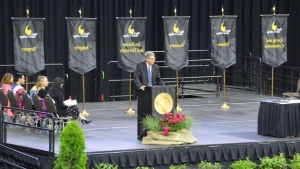 Stage with banners and speaker at podium